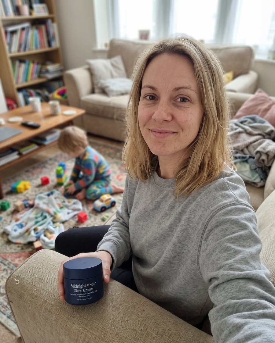 Sarah K. at home holding the Sleep Cream tub
