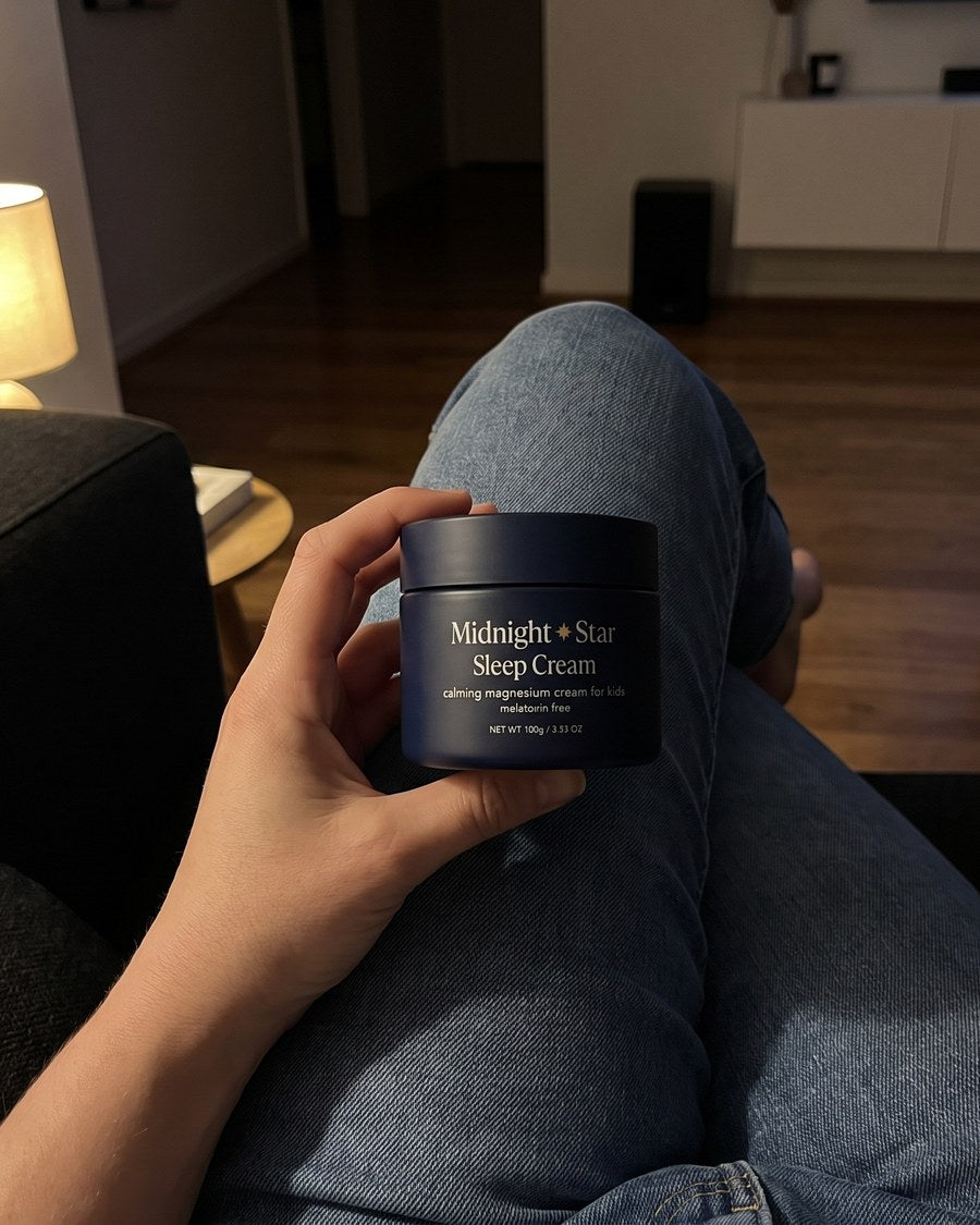 Sarah P. on her couch in the evening holding the Sleep Cream tub