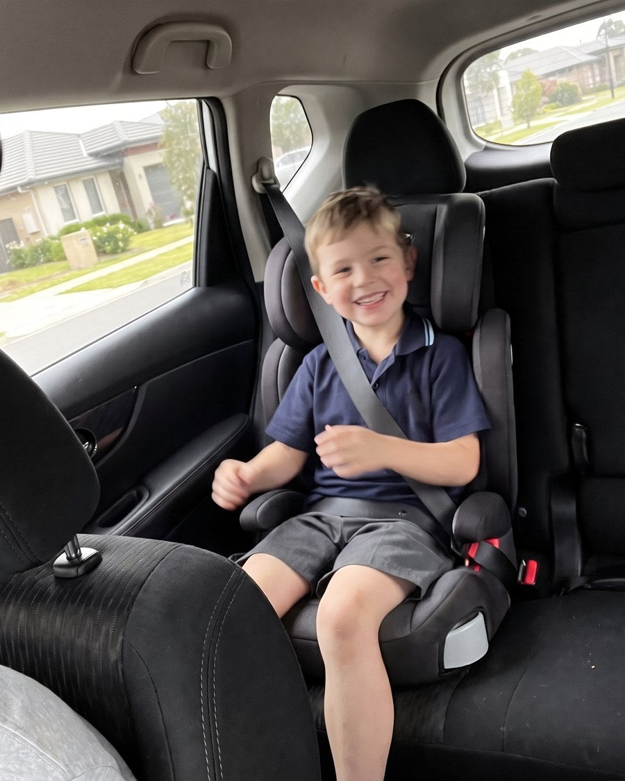 Jess M.’s son in the back of the car on the school run