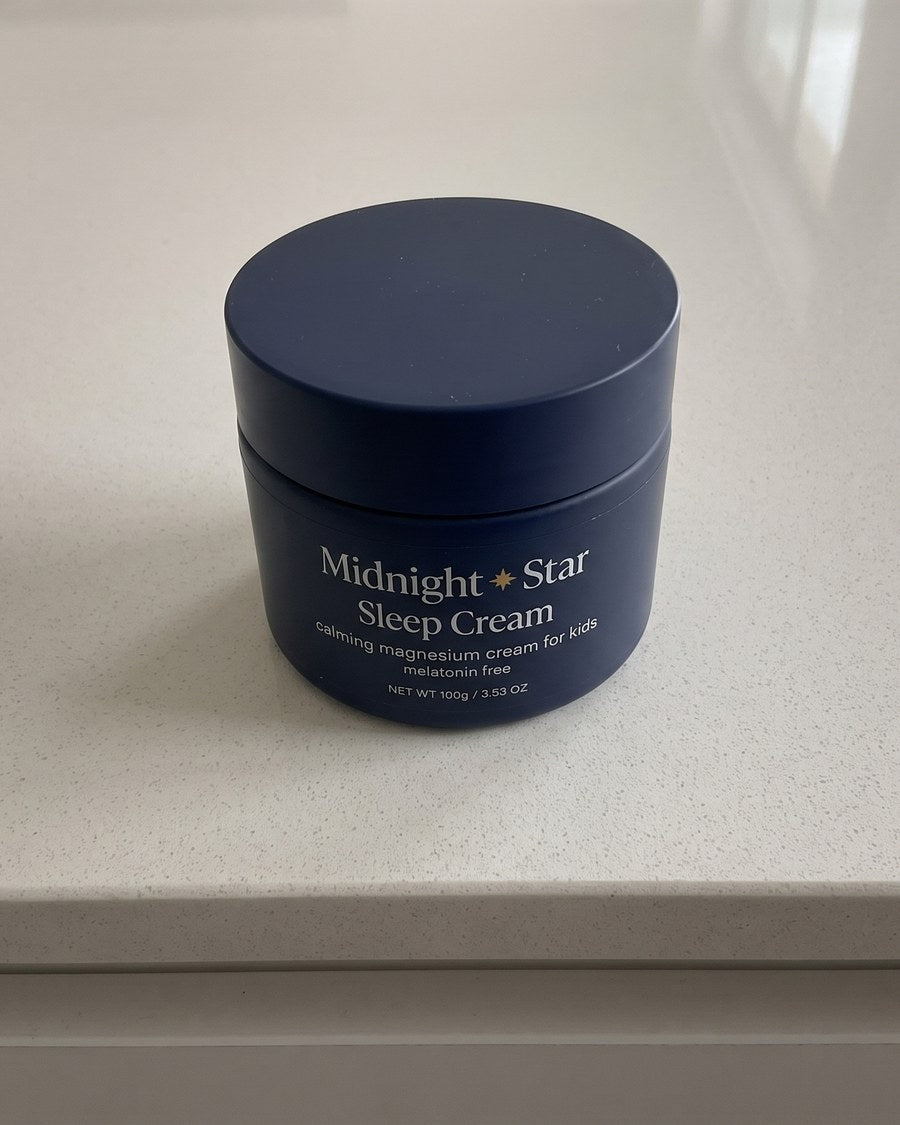 The Sleep Cream tub on a kitchen bench